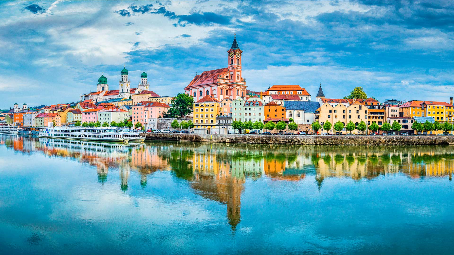 The city of Passau reflecting in the Danube river