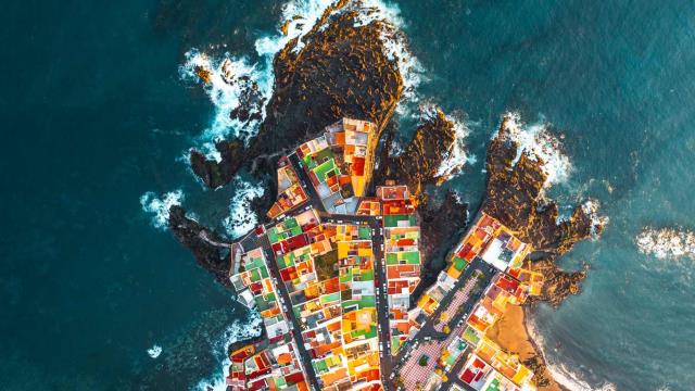 Aerial view of colourful houses on a headland in Puerto de la Cruz